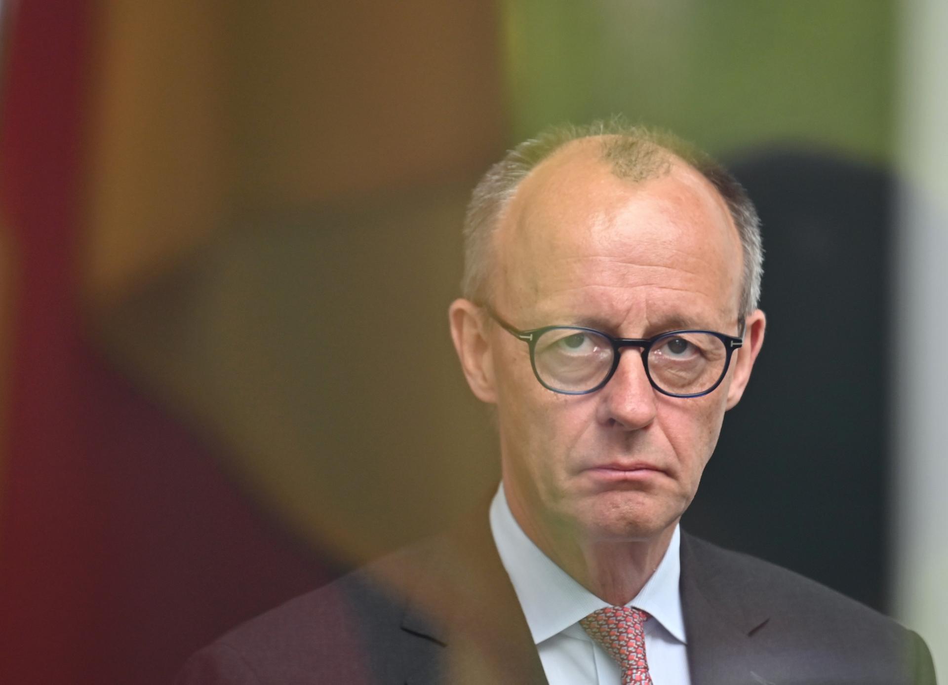 Merz priznava težave CDU, odstop pa zavrača